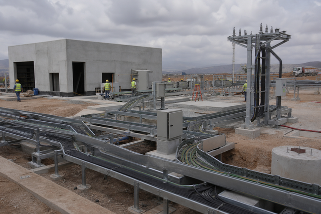 Electrical installation yard with cable routing (illustrative).
