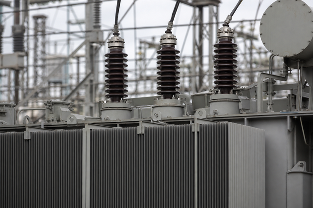 Power transformer bushings and cooling assembly (illustrative).